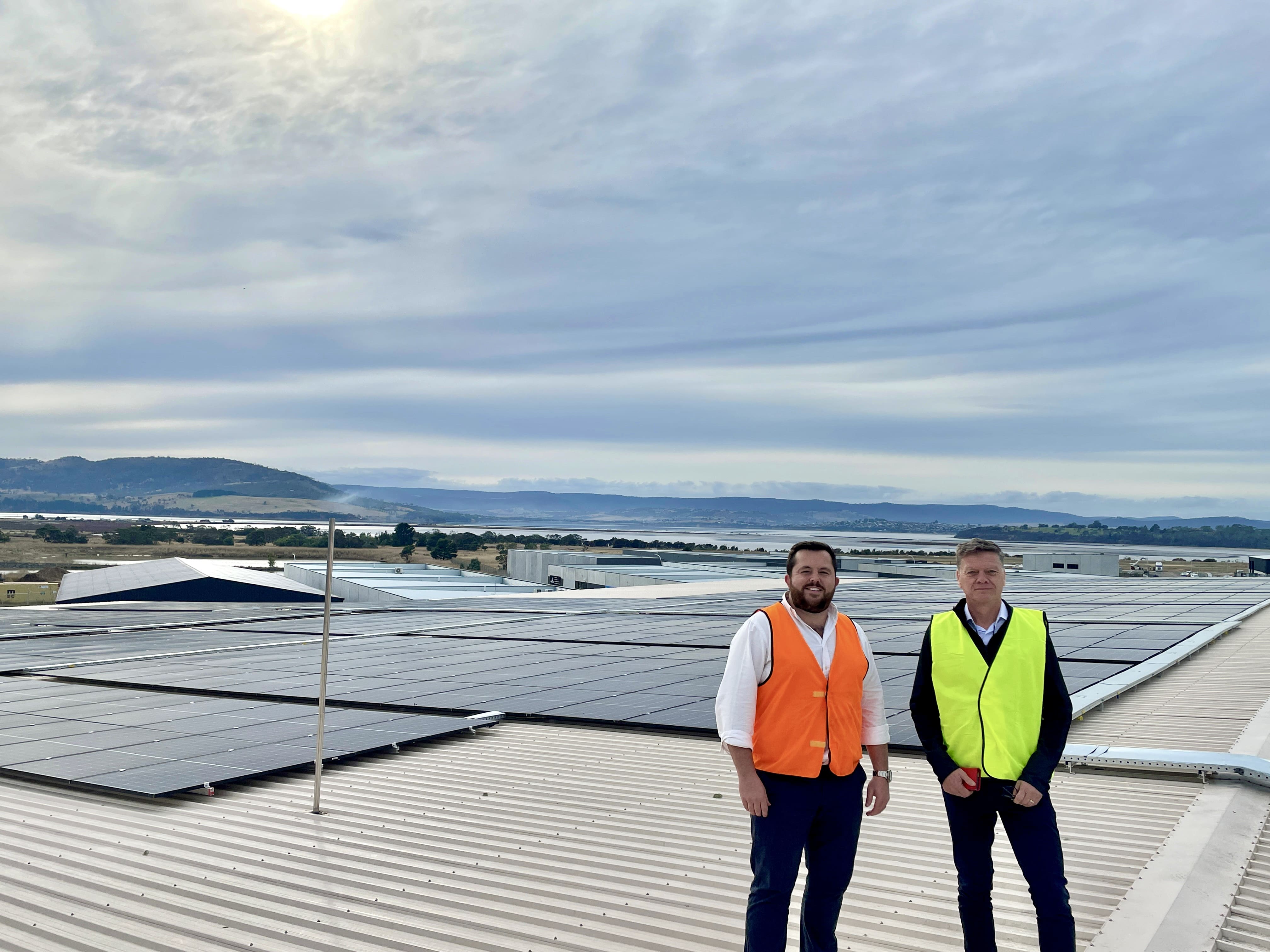 Nick Blacklock and Paul Mealor standing in front of Juicy Isle's solar system